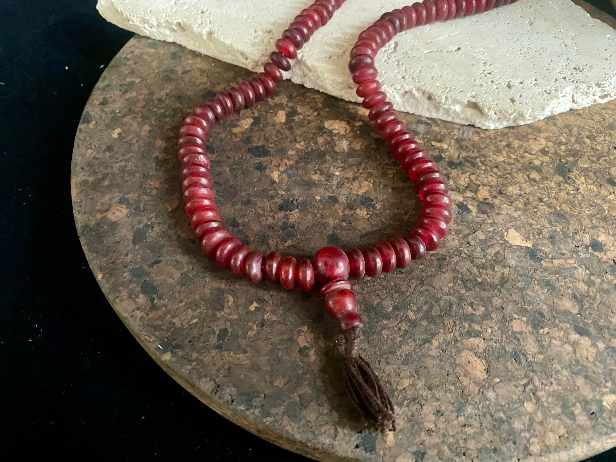 Women or men’s buffalo horn Buddhist mala. As per a standard Buddhist mala it contains 108 beads and has a central stupa bead. From Nepal. About 35 cm length including tassle. Fits easily over the head. Bone beads are approximately 1 cm x 3 mm