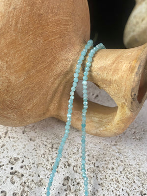 Natural clear blue amazonite facet cut fine bead choker. Brass screw clasp. Length 39.5 cm