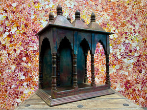 Solid timber shrine, nicho or display box, with three sections or bays,  beautifully carved and finished on three sides and inside with carved pillars, solid wood back, stepped up footing and peaked roof with finial. Most likely teak. Dates from the 1950-60s, southern India. Height 47.5 cm, depth 25 cm, width 38 cm