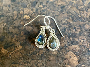 Elegant teardrop shaped earrings with a beautifully detailed bezel to show off the natural beauty of the cabochon stones. Sterling silver hooks complete the look. Our earrings are open-backed to allow natural light to show through. Length including hook 2.7 cm