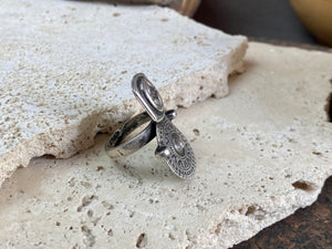 Statement tribal silver ring from regional Rajasthan, India. High grade or sterling silver. Adjustable back so it will fit a number of different finger sizes. Measurements: Ring face: 3.4 x 2.6 cm Size: Anywhere from size 6 to size 8, this ring is adjustable
