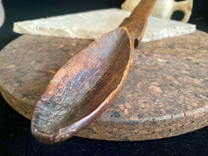 Very old wood serving spoon or ladle. Hand carved fine grained wood. From northern Ethiopia.This spoon has a lovely worn patina commensurate with its age. The spoon end is darkened from use in or near an open fire. Early 20th century. Length 44.5 cm