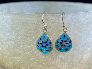 Beautiful hand crafted enamel and sterling silver dangle earrings from Jaipur, India. Lightweight and easy to wear, with sterling silver hooks. Plain silver backs. 3 cm drop including hook, the enamelled panel is 2 cm in length