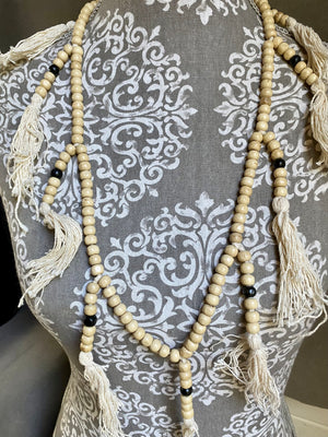 Women or men’s mala necklace. Made from lightweight wood, 108 beads and tasseled spacers. This is a light summer necklace that can be worn or simply hung as decoration. Total length 72 cm. Fits easily over the head. Wood beads 6 mm diameter