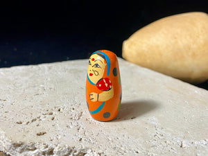 Novelty beads perfect for beading projects or as little doll statues. Made from lightweight wood and hand painted in the style of babushka dolls but with an Indian twist, our wood beads are great gifts for kids. Light enough to be worn as earrings. Perfect for a jewellery project. Height 2.6 cm, width 1.5 cm