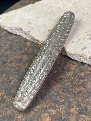 Silver 1.5 Tamlung Lat (short for talat, or currency), often called tiger tongue money, with 3 na (snake) marks. Circa 1591-1707. Laos Vientiane.  This is a hand poured silver ingot with its original patina. Length 11.8 cm