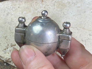 This Shiva lingam box or container is is a fine example of casket workmanship. Dating from the early 20th century or earlier, it is hand cast from high-grade silver & features wear marks commensurate with a piece this age. Measurements: Height 4.8 cm (1.85"), width 5 cm (2")