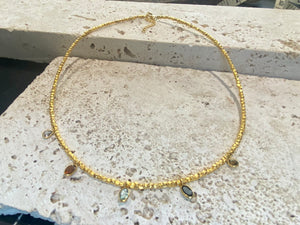 Vibrant gemstones adorn this elegant multi charm necklace. Plated 22k gold over brass, the multicoloured gemstones are evenly spaced and bezel-set to highlight the beauty of each gemstone. This necklace is designed to be worn short, but comes with an extension chain so you can set the length according to your neckline. Measurements: length 41 cm, with extension chain 45.5 cm
