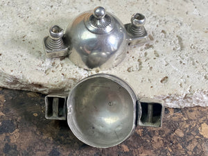 This Shiva lingam box or container is is a fine example of casket workmanship. Dating from the early 20th century or earlier, it is hand cast from high-grade silver & features wear marks commensurate with a piece this age. Measurements: Height 4.8 cm (1.85"), width 5 cm (2")