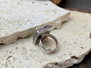 Silver tribal ring, set with a large antique Tibetan turquoise stone. This substantial heavy ring weighs almost 15 grams. Will suit either men or women. Afghanistan. Measurements: Ring face 2.2 x 2 cmInner diameter 17.5 mm | Size 7, however this is an adjustable ring that will fit any finger from size 6 to 8.