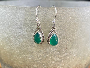 Elegant teardrop shaped earrings with a beautifully detailed bezel to show off the natural beauty of the cabochon stones. Sterling silver hooks complete the look. Our earrings are open-backed to allow natural light to show through. Length including hook 2.7 cm