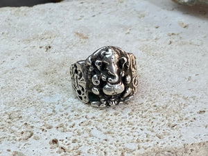 Vintage silver Ganesh ring from Rajasthan, India, weighing over 15 grams. A beautiful depiction of Lord Ganesha with small open piercings to each side of Ganesh and an image of the Tree of Life on the back. This is a stunning silver ring that can worn by men or women. Ganesh: 2 x 1.7 cm Size: 18.25 mm| Size 8