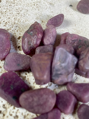 Natural rubies. Uncut and unpolished. Each ruby is unique and will bring its own character to your crystal collection. Approximate size of each stone  Large: between 2 and 3 grams. length around 1.5 cm Small: between 1 and 2 grams, length around 1 cm Select your preferred size from the drop down menu. Price is per single piece and we will select a piece to send you.