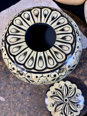 A beautiful low oval lidded bowl or box, traditionally called an opium pot because of its shape. Crafted from hand shaped panels of camel bone over wood, then hand painted. Hand made in Rajasthan, India. Measurements: diameter 15.5 cm, height 6.5 cm.