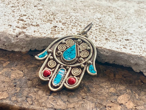 Beautiful hand made large hamsa pendant or charm set with ceramic turquoise and coral inserts. Non silver. Large bail for hanging. This is not just a piece for wearing around the neck. It can be hung anywhere you'd like it in the house. Height 5 cm