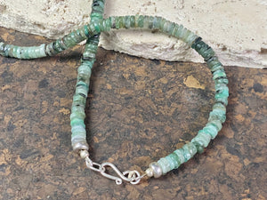Heshi cut natural emerald necklace features sterling silver findings and a hook clasp.  These colour graduated emeralds are of every imaginable shade of green, ranging from pale to dark, from clear to cloudy. Length 45 cm