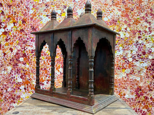 Solid timber shrine, nicho or display box, with three sections or bays,  beautifully carved and finished on three sides and inside with carved pillars, solid wood back, stepped up footing and peaked roof with finial. Most likely teak. Dates from the 1950-60s, southern India. Height 47.5 cm, depth 25 cm, width 38 cm
