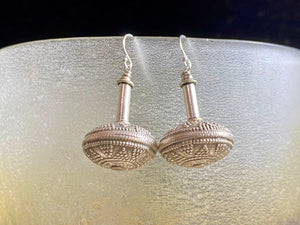 Get the look without the weight.  These earrings are big and impressive, but they are also lightweight and easy to wear. Why? Because our earrings are crafted from handmade vintage Indian hollow-construction sterling silver beads.  These beads date to the mid 20th century and were collected by Bernard Heaphy, the founder of kashgar, from northwest India.  Measurements: length 4 cm