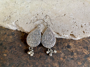 Exquisite miniature hand painted earrings featuring Ganesh seated, set within sterling silver frames, backed with decorated silver and set with a silver dangles bail at the base. Bought from the artist who painted them in India, then set into silver. Measurements: 6 cm (2.35") height including hooks or 2 cm at widest point