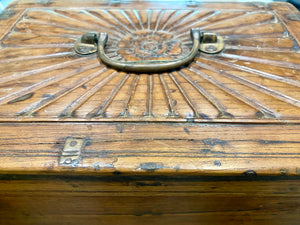 A lovely old southern Indian cash box with carved top and original brass trim, handle and hinges. Fitted with two small shelves inside. Made from teak, this would make a lovely trinket box, key box, jewellery, watch or cufflink box Circa 1880 - 1920. Measurements: length 27.5 cm x depth 19 cm, height 15 cm.