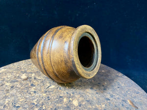A small shaped wood pot with three carved lines of decoration. Carved from hardwood, most likely rosewood. Late 20th century vintage. Measurements: diameter at widest point 9 cm, diameter of opening 4.5 cm, height 12 cm