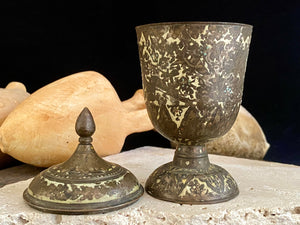 Russian Orthodox church communion chalice. Early 20th century. Engine turned brass with elaborate inlay enamel decoration in white with blue and red highlights. The enamel work is very worn and rubbed in places. Height 15 cm, width 6.5 cm.