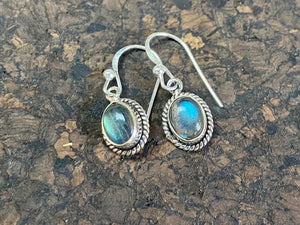 Elegant oval shaped earrings with a beautifully detailed bezel to show off the natural beauty of the cabochon stones. Sterling silver hooks complete the look. Our earrings are open-backed to allow natural light to show through. Length including hook 2.5 cm