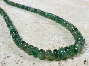 A classic necklace of graduated, matched natural emeralds featuring sterling silver findings and hook clasp. 70 carats of emeralds, length 45.5, bead size 2 mm - 6 mm