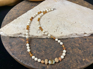 Our unique statement necklace features beautiful vintage beads from the Kashgar collection - turquoise centre bead, jasper beads from the Philippines, howlite beads, buffalo horn beads and 925 sterling silver detailing and lobster clasp. Length 45 cm.