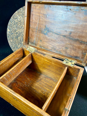 A lovely old southern Indian cash box with carved top and original brass trim, handle and hinges. Fitted with two small shelves inside. Made from teak, this would make a lovely trinket box, key box, jewellery, watch or cufflink box Circa 1880 - 1920. Measurements: length 27.5 cm  x depth 19 cm, height 15 cm.