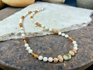 Our unique statement necklace features beautiful vintage beads from the Kashgar collection - turquoise centre bead, jasper beads from the Philippines, howlite beads, buffalo horn beads and 925 sterling silver detailing and lobster clasp. Length 45 cm.