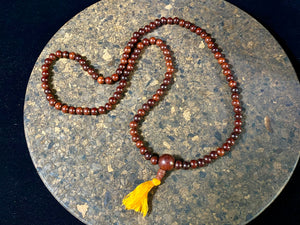 Women or men’s mala necklace, made from natural, dark sandalwood. This beautiful mala is exceptionally well made and has a pleasing lustre, weight and feel in the hand. As per a standard Buddhist mala, it contains 108 beads. From India
