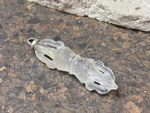 Hand carved rock crystal dorje or vajra pendants. Top mounted sterling silver bail. Approximately 6 cm in length and carved from Himalayan quartz.