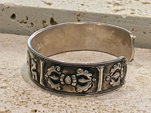 Sterling silver Buddhist Om Manu Padme Hum bracelet. This is a large and substantial men's silver cuff  This beloved Buddhist mantra translates to “hail, jewel in the lotus” and is the prayer of the Compassionate Buddha Avelokitsvara.