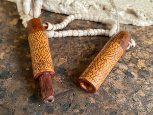 This is a vintage wood sewing needle case from northern Thailand, from the Ahka tribe. This beautiful, old and rare vintage piece is highly decorated and made from bamboo, etched, stained with red betel juice and finished with a long fringe of Jacob's tears. Length 24.5 cm with fringe, length of tube 9 cm