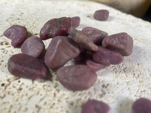 Natural rubies. Uncut and unpolished. Each ruby is unique and will bring its own character to your crystal collection. Approximate size of each stone  Large: between 2 and 3 grams. length around 1.5 cm Small: between 1 and 2 grams, length around 1 cm Select your preferred size from the drop down menu. Price is per single piece and we will select a piece to send you.