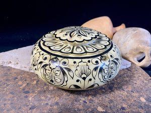 A beautiful low oval lidded bowl or box, traditionally called an opium pot because of its shape. Crafted from hand shaped panels of camel bone over wood, then hand painted. Hand made in Rajasthan, India. Measurements: diameter 15.5 cm, height 6.5 cm.