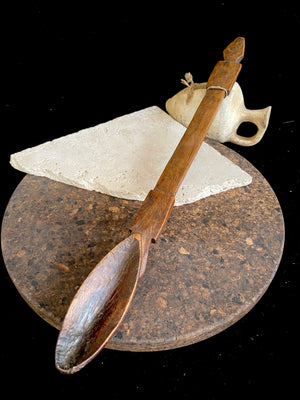 Very old wood serving spoon or ladle. Hand carved fine grained wood. From northern Ethiopia.This spoon has a lovely worn patina commensurate with its age. The spoon end is darkened from use in or near an open fire. Early 20th century. Length 44.5 cm