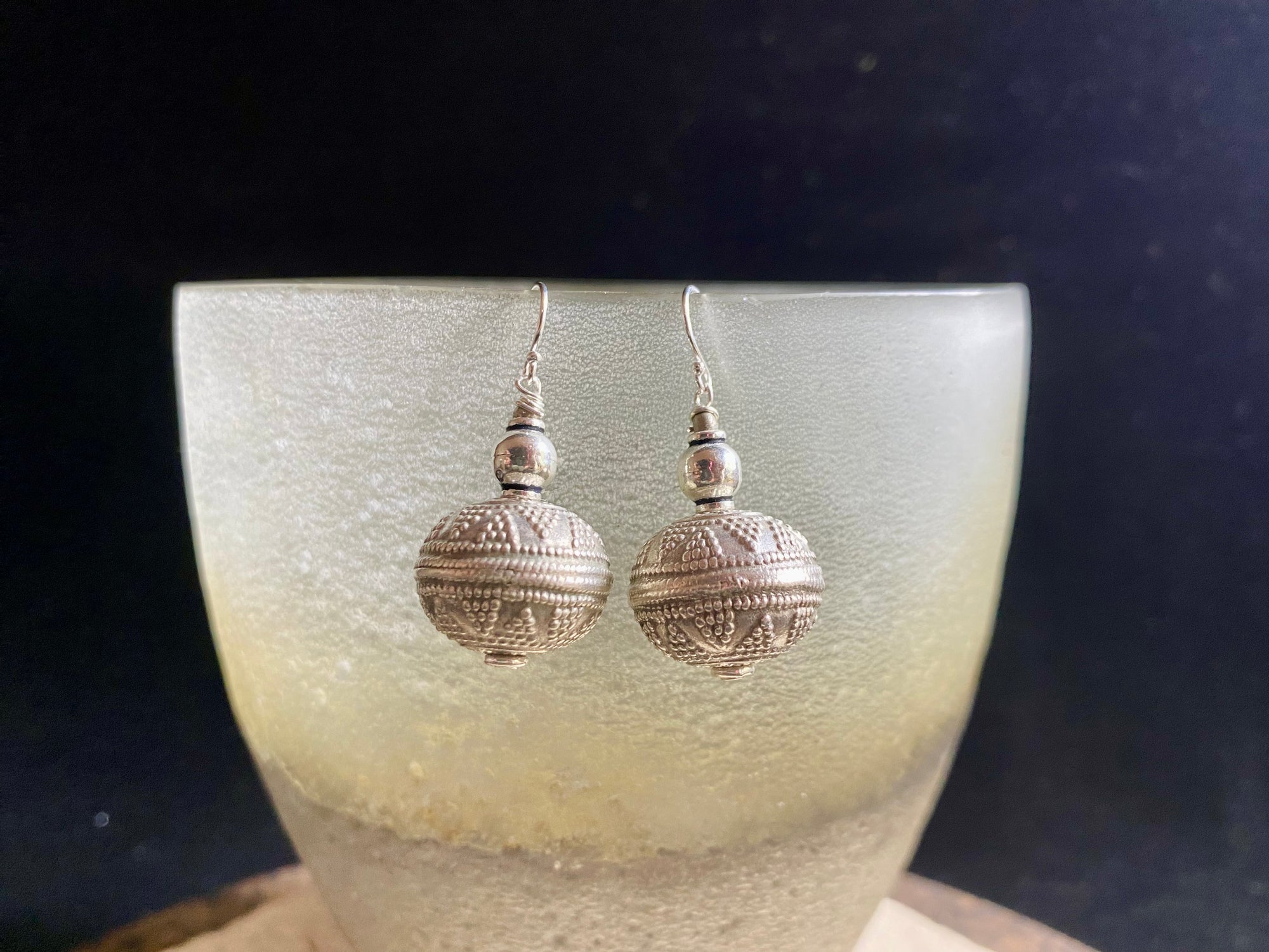 Get the look without the weight. Lightweight and easy to wear, these earrings are crafted from hollow-construction handmade vintage sterling silver beads and components.&nbsp; Mid 20th century beads collected by Bernard Heaphy from northwest India.  Measurements: length 4 cm