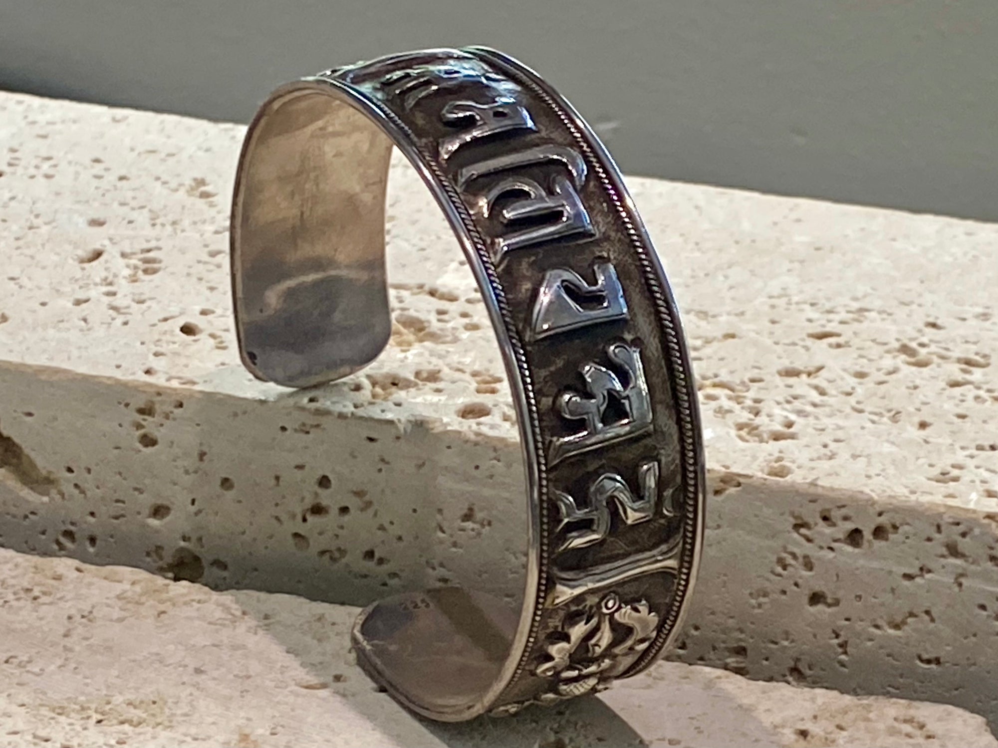 Sterling silver Buddhist Om Manu Padme Hum bracelet. This is a large and substantial men's silver cuff  This beloved Buddhist mantra translates to “hail, jewel in the lotus” and is the prayer of the Compassionate Buddha Avelokitsvara.