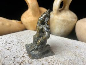 A small cast brass Hanuman in forward kneeling style. This piece has some rubbing on the face, shows a naturally darkened patina and is approximately 80 years old, although it may be older. Gujarat, India.    Measurements: height 6 cm