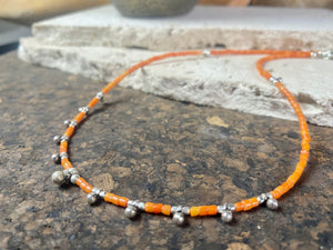 Fine cut beads of bamboo coral, highlighted with traditional handmade sterling silver Rajasthani ball beads. Finished with sterling silver findings and hook clasp. Designed to be unisex, this necklace would look stunning on men and women. Measurements: 41 cm (15.85")