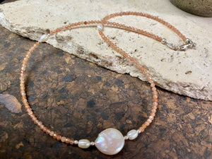 Natural clear pink/orange sunstone bead necklace is teamed with cultured pearls and sterling silver detailing. A silver lobster clasp complete the look. Length 40.5 cm