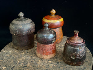 Antique small tikka pots. Hand carved teak, lacquer paint. Approx 50-90 years old. Assorted shapes, sizes and colours. Height approximately 9-12, diameter 6-8 cm