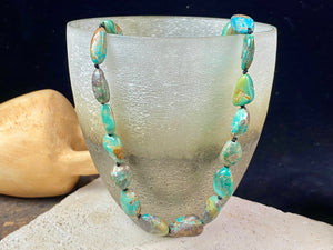 Tibetan turquoise necklace. Knotted between each bead and finished with sterling silver clasp. length 46.5 cm