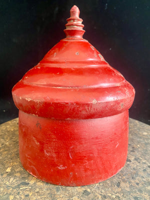 Large red lacquered tikka pot or tikka boxes. Hand carved from single hollowed out pieces of teak, these lidded pots traditionally hold the red vermillion (bindi) powder used for marking the forehead during Hindu ceremonies. They date to the early 1900s. Measurements: approximate diameter 12-14 cm, height 16-18 cm 