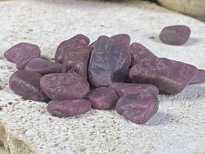 Natural rubies. Uncut and unpolished. Each ruby is unique and will bring its own character to your crystal collection. Approximate size of each stone  Large: between 2 and 3 grams. length around 1.5 cm Small: between 1 and 2 grams, length around 1 cm Select your preferred size from the drop down menu. Price is per single piece and we will select a piece to send you.