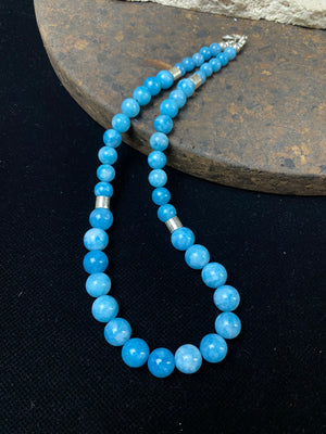 Graduated blue chalcedony necklace with sterling silver bead detailing and a sterling silver hook clasp. Measurements: 41.5 length including hook, diameter of beads 8, 6 and 4 mm