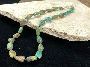 Tibetan turquoise necklace. Knotted between each bead and finished with sterling silver clasp. length 46.5 cm
