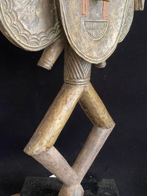 Mbulu-ngulu or funerary reliquary protective figure. Kota people, Gabon, West Africa. Mid to late 20th century. Wood with copper and brass decorative overlay. Height 54 cm, width at widest point 30 cm.